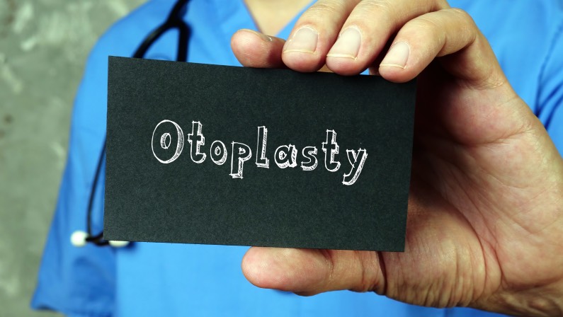 Health care concept meaning Otoplasty with inscription on the piece of paper.